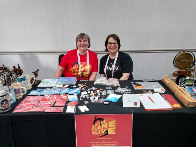 Jill Jaracz and Alison Brown at their 2023 Olympin Show table.