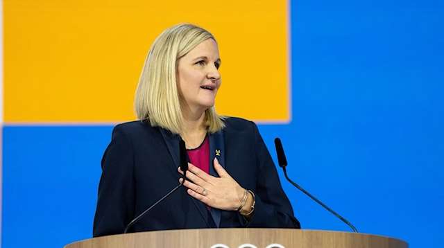 Kirsty Coventry at the speakers' podium at the 144th International Olympic Committee Session.